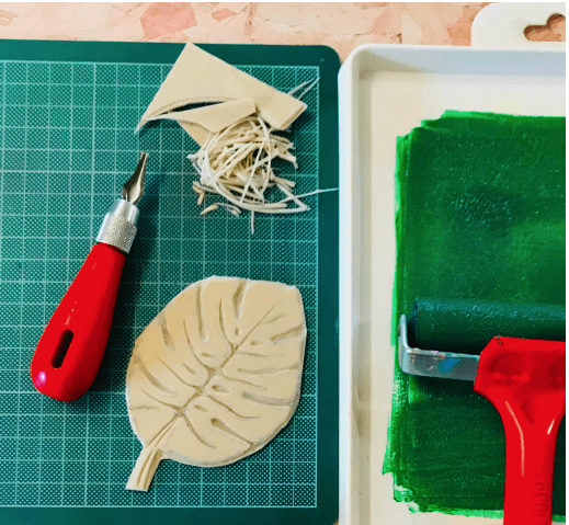 monstera leaf carved onto SoftCut, ink tray with green block printing ink