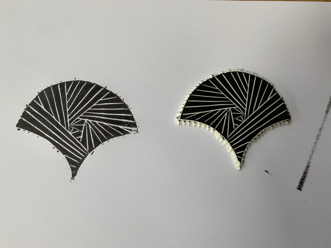 IMG_1361 Fan image printed in black onto paper next to mastercut stamp