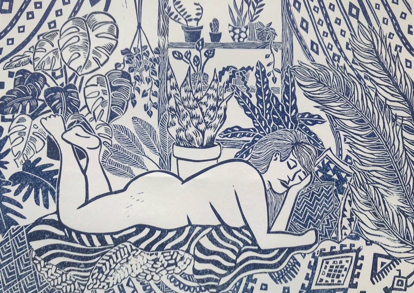 Lino print of naked lady lying amongst plants