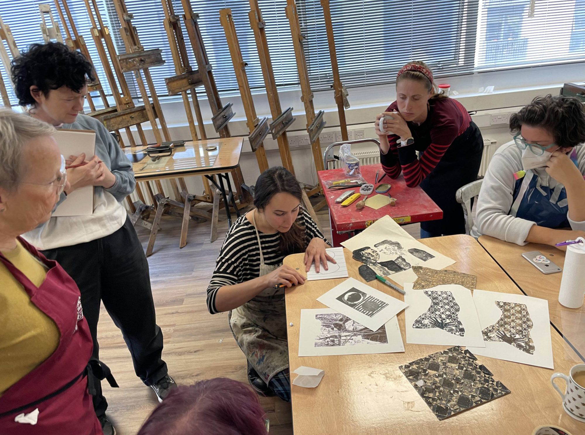 Photo of artist Scarlett Rebecca running a printing workshop