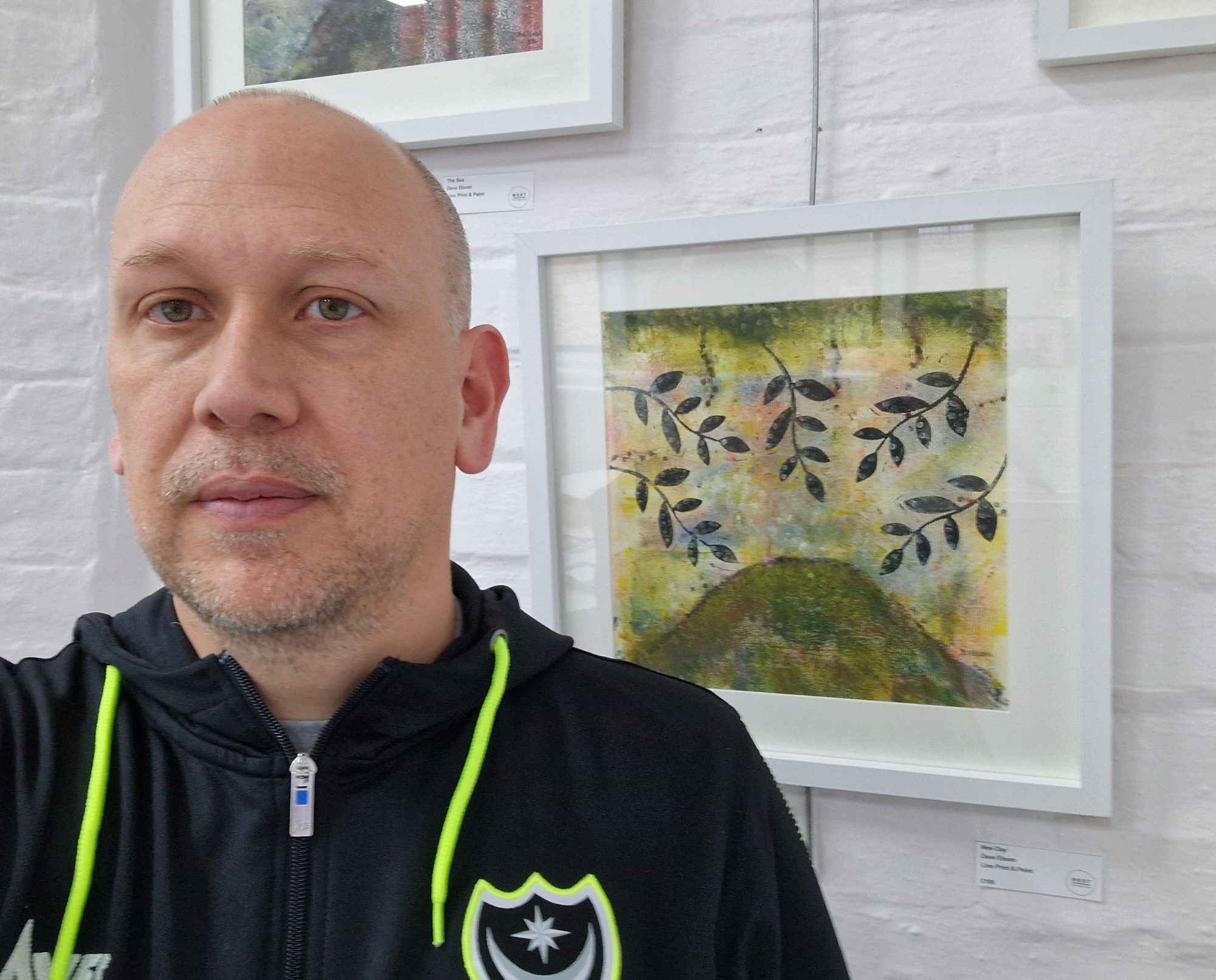 Linoprint artist Dave Elsom in front of one of his linoprints