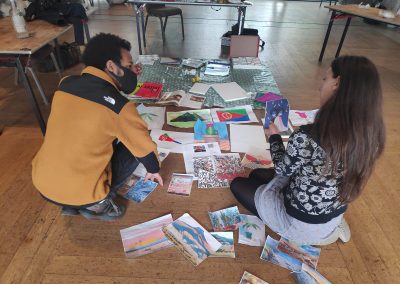 Young people at charity Revoke looking at artwork