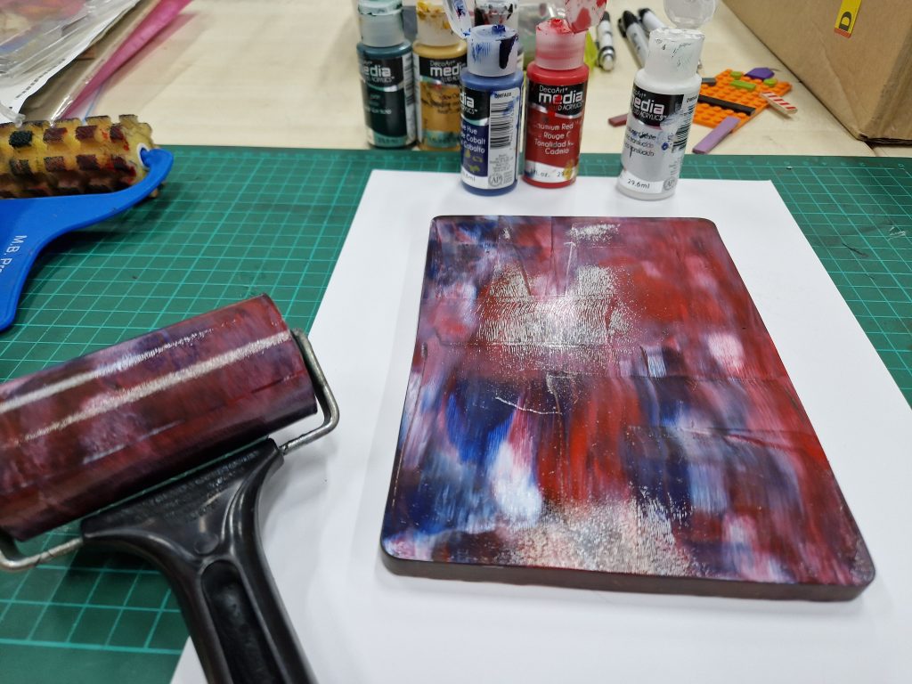Gelli plate with red and blue in