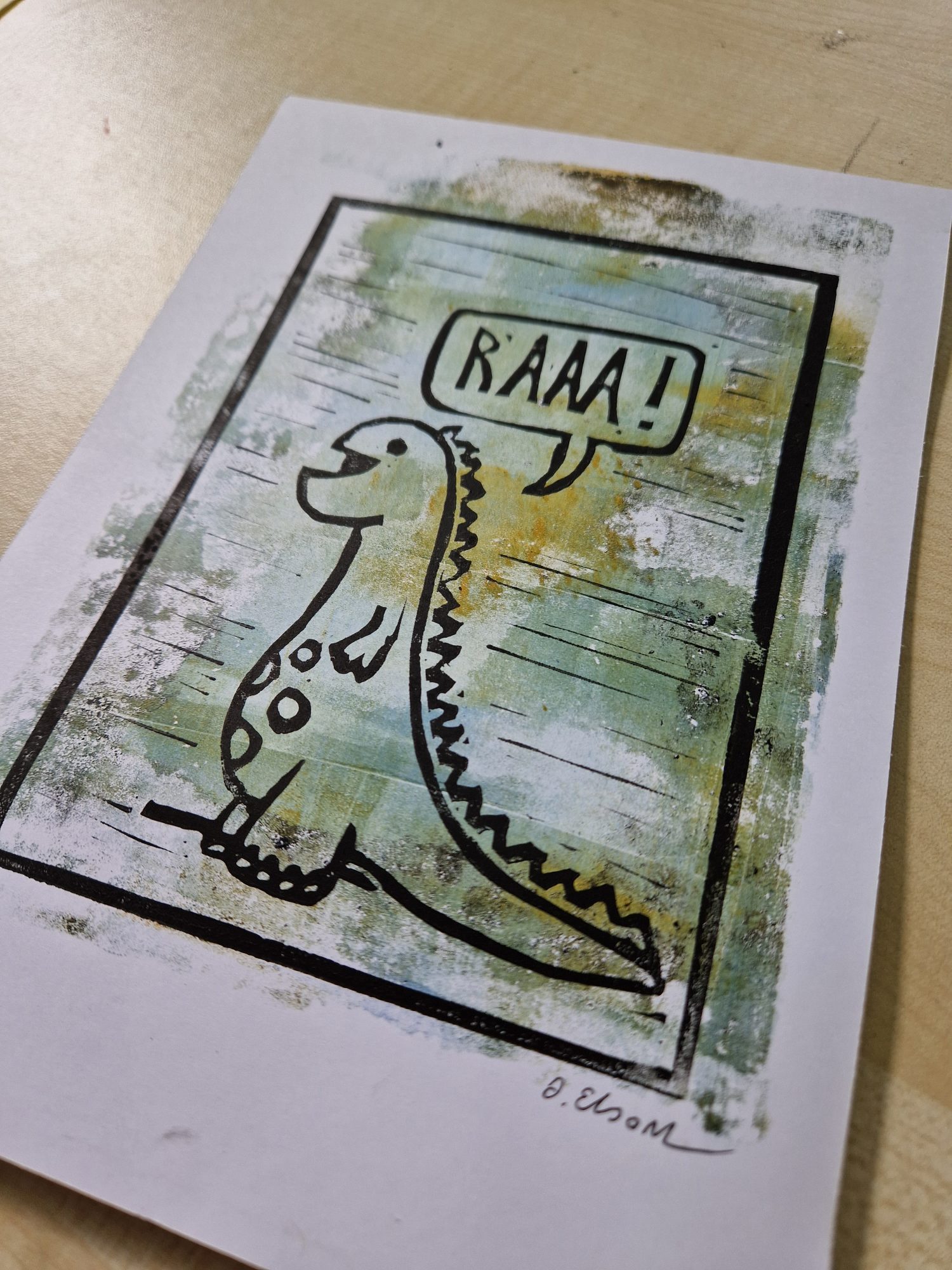 Linoprint of dinosaur on gelli plate background