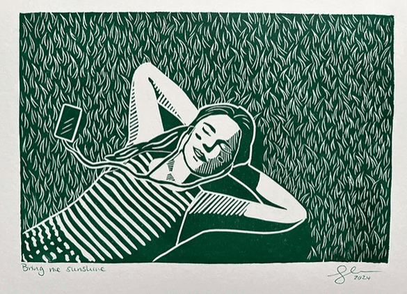 Bring Me Sunshine linoprint of woman lying on the grass listening to music by @georginadoodles